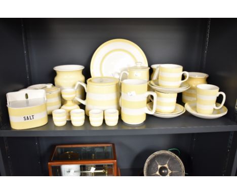A collection of Cornishware kitchenalia, decorated in yellow and white bands, to include coffee pot, egg cups, saucers, milk 