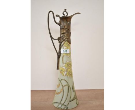 An attractive Art Nouveau style metal mounted Ewer, decorated with floral patterns on a green crackle glaze ground,  marked '