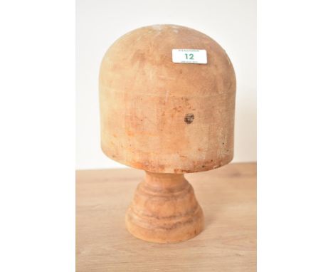 An early 20th century solid beech hat block, h28cm