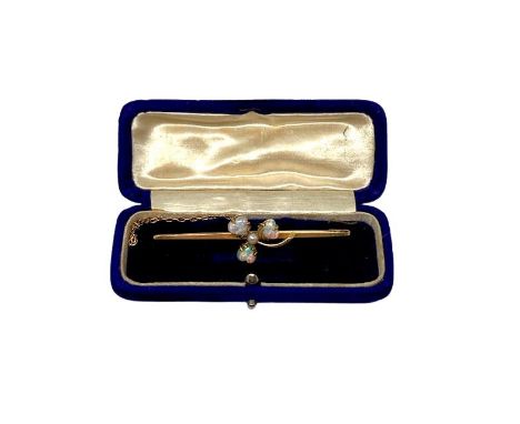 A 15ct gold opal and seed pearl bar brooch, width 60 mm, 3.3g. CONDITION REPORT: Three heart shaped opals in good condition, 