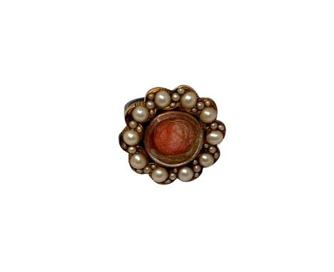 A Victorian seed pearl mourning brooch, converted to a ring, size J/K, 5g. CONDITION REPORT: The central glass panel with hai