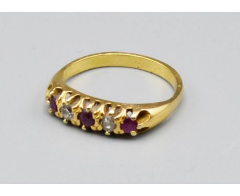 An 18ct Ruby And Diamond Band Ring, set with two diamonds and three rubies, 2.9 grams, ring size K 