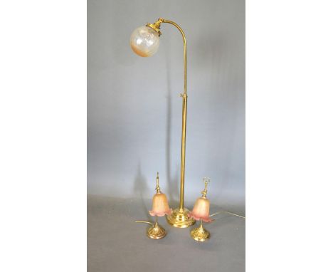 A Pair of Brass Adjustable Table Lamps together with a similar brass adjustable lamp standard 