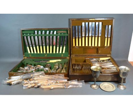 A Silver Plated Canteen of Cutlery housed within an oak cabinet together with another similar and various other silver plated