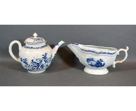 A First Period Worcester Sauce Jug decorated in underglaze blue with a reserve together with a similar first period Worcester