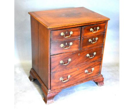 A 19th Century Mahogany Converted Commode, the moulded top above three doors simulated as drawers with brass handles raised u