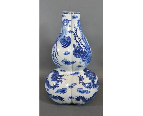 A 19th Century Chinese Porcelain Gourd Vase of Triform decorated in underglaze blue with serpents, blue seal mark to base 28c