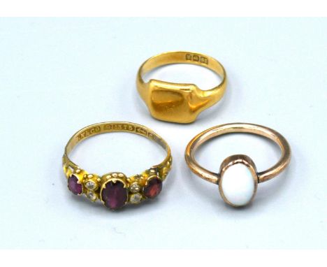 An 18ct. Gold Signet Ring, 3.4 gms. together with two dress rings 