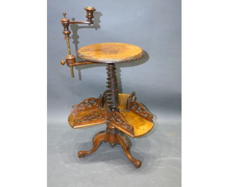 A Victorian Burr Walnut Book Stand, the circular top with adjustable candle sconce and with spiral twist column and shaped pi