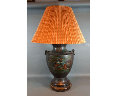 A Chinese Patinated Metal Champleve Decorated Table Lamp with figures amongst foliage and pierced hardwood stand, 75 cm tall 