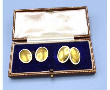 A Pair of 18ct. Gold and Enamel Decorated Cufflinks within original fitted box, 9.8 gms. 
