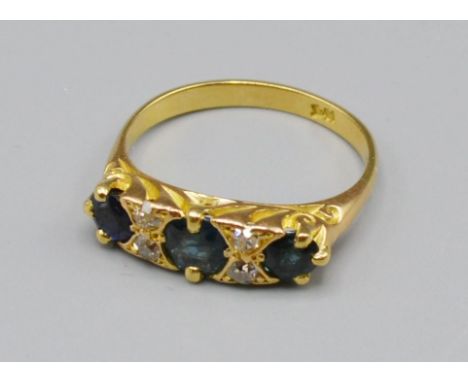 An 18ct Gold Sapphire And Diamond Ring, set with three Sapphire and four diamonds, 4 grams, ring size N 