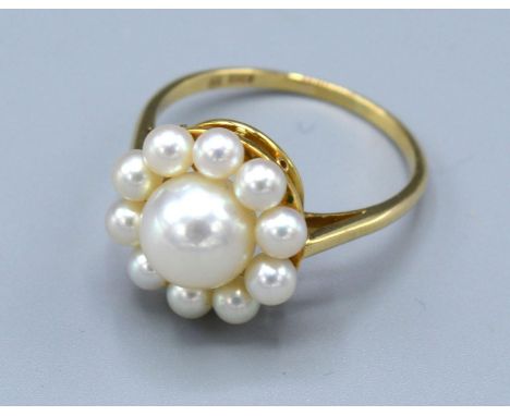 A 14 ct. Gold Pearl Cluster Ring by Mikimoto, 3.2 gms. ring size Q 