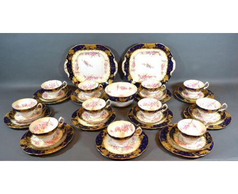 A Hammersley Porcelain Tea Service comprising eleven cups, ten saucers, eleven plates, two serving plates and a bowl 