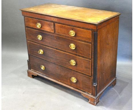 An Early 19th Century Mahogany Straight Front Chest of two short and three long drawers with oval brass handles flanked by re