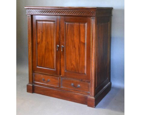 A 20th Century Hardwood Side Cabinet with two panel doors above two drawers raised upon a plinth base, 100 cms wide, 60 cms d