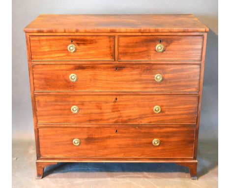A 19th Century Mahogany Straight Front Chest of Two Short and Three Long Drawers with circular brass handles raised upon brac