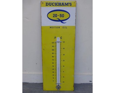 A Duckham's 20-50 Motor Oil enamel thermometer, in very good condition, 13 x 36".