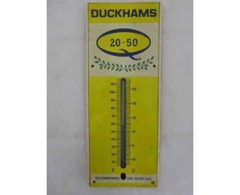 A Duckhams 20-50 tin fronted and plastic wall thermometer of unusual small size, 5 1/2 x 13".
