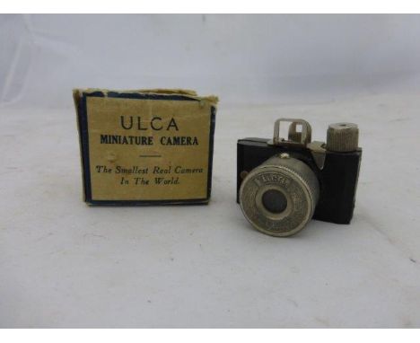 A boxed Ulca miniature camera - 'The smallest real camera in the world'.