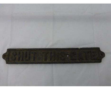 An early cast iron gate sign 'Shut This Gate', 17 x 2 1/2".