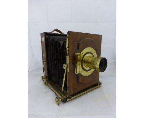 An early mahogany and brass mounted plate camera on tripod bearing an ivorine plaque - J.R. Grotz Patent London, No. 172.