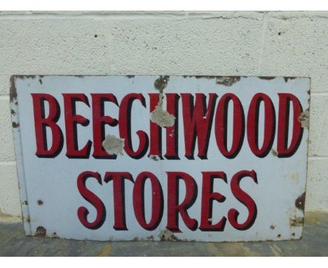 A Beechwood Stores rectangular enamel sign, 37 x 21".