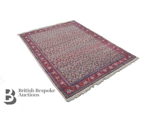 20th century wool carpet, having a central field with green medallions enclosed by a foliate border, approx 352 x 276 cms, se