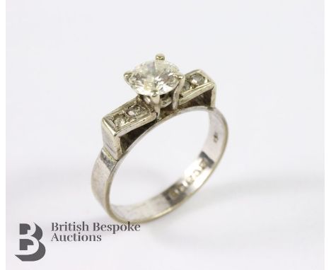 9ct white gold diamond ring, set with a central diamond approx 63 pts, with a further 6pts of dias to the shoulders, size K+,