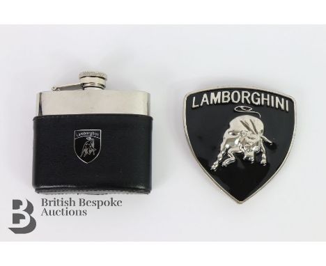 Lamborghini black enamelled and nickel-plated shield shaped belt buckle for the Lamborghini driver; together with a Lamborghi