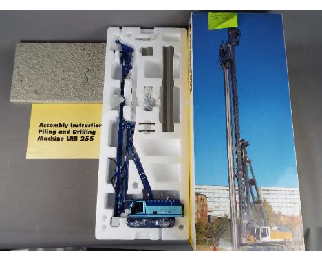 NZG - A boxed 1:50 scale diecast NZG #668 Liebherr LRB255 Litronic Piling and Drilling Rig. The model appears to be in Mint c