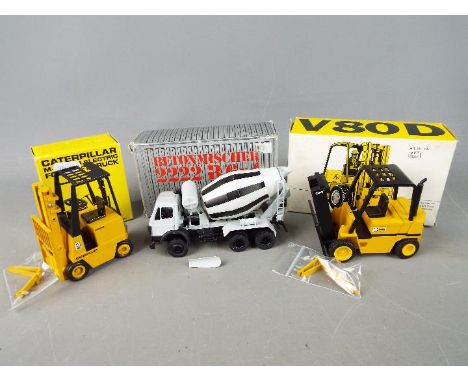 Conrad, NZG - Three boxed diecast construction vehicles in various scales. Lot includes Conrad 1:24 Caterpillar M-Series Elec