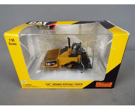 Norscot - A boxed 1:50 scale diecast Norscot #55259 Caterpillar AP600D Ashalt Paver. The model appears to be in Mint conditio