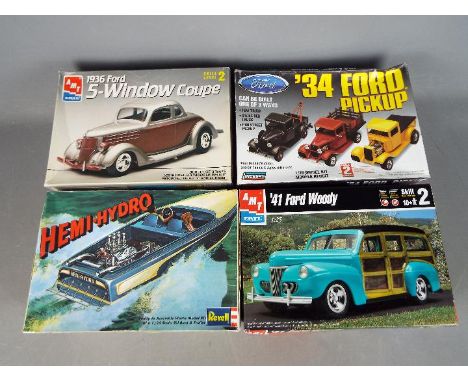 Lindberg, AMT, Revell - Four boxed plastic model kits in 1:25 scale. Lot includes AMT #30052 '41 Ford Woody; AMT #6924 1936 F