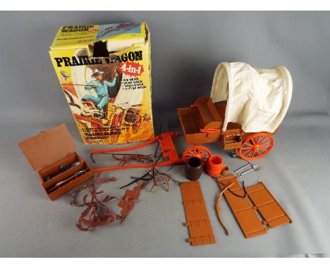 Marx - A boxed 'The Lone Ranger Ranger 4-in-1 Praire Wagon'. The model has signs of use and play wear, but generally appears 