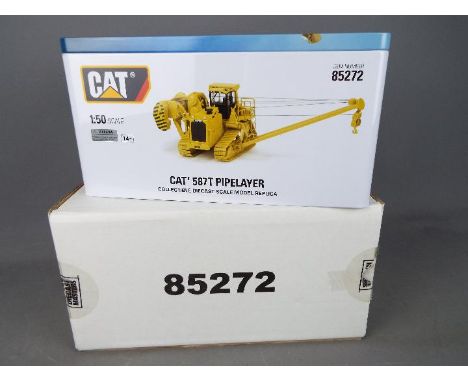 Diecast Masters - A boxed 1:50 scale #85272 Cat 587T Pipelayer by Diecast Masters. The model appears to be in Mint condition 