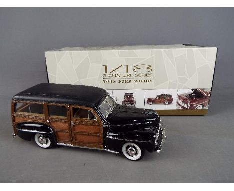 Lucky Diecast - A boxed 1:18 scale Lucky Diecast Signature Series 1948 Ford Woody. Model appears to be in Mint condition in a