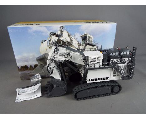 Conrad - A boxed 1:50 scale diecast Conrad #2942 Liebherr R9800 Mining Excavator. Model appears to be in Mint condition, hous