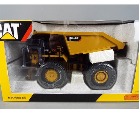 Tonkin Replicas - A boxed 1:50 scale Tonkin Replicas TR30001 diecast Cat MT4400D AC Mining Truck. The model appears to be in 