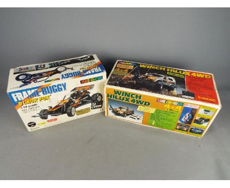 Nikko - Two boxed vintage radio controlled model vehicles by Nikko. Lot includes a Nikko 1:16 scale Winch Hilux 4WD; and a 1;