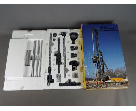 NZG - A boxed diecast 1:50 scale NZG #6681 Liebherr LRB255 Litronic Piling and Drilling Rig Equipment Package. The equipment 