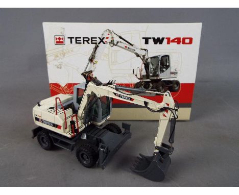 NZG - A boxed diecast 1:50 scale NZG #697 Terex TW140 Mobile Excavator. The model in grey and black appears to be in Mint con