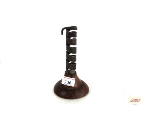 An 18th Century wrought iron candlestick base