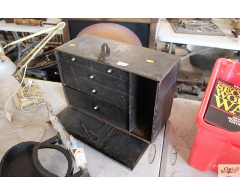 A vintage metal five drawer tool box