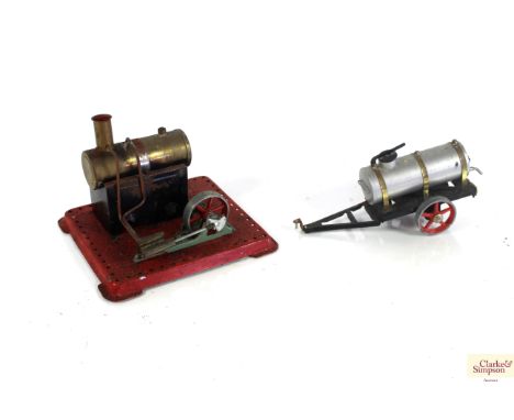 A Meccano type spirit fired stationary engine and a Wilesco tin plate model of a water bowser
