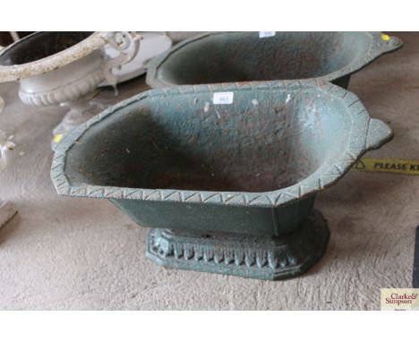 A green painted cast iron planter, approx. 24" long