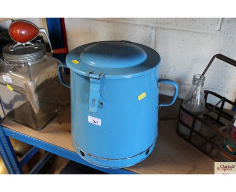 A vintage blue enamel storage bin