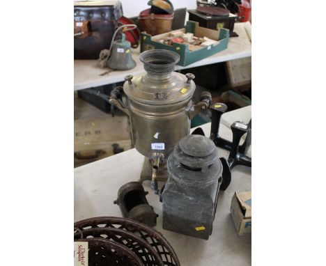 A brass samovar, a small lamp and part of a coach lamp