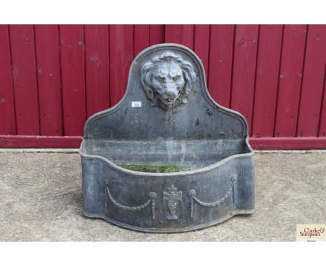 A lead water feature / planter having lion mask decoration, approx. 26" wide x 25" high