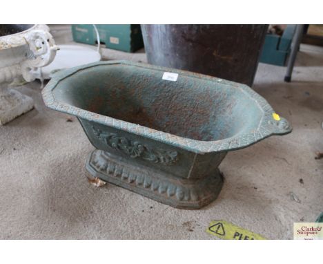 A green painted cast iron planter stamped No.2, approx. 23" long